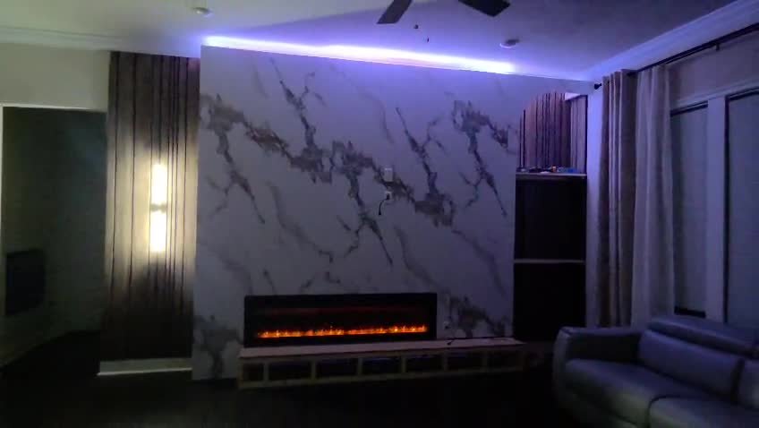 Marble accent wall with linear electric fireplace